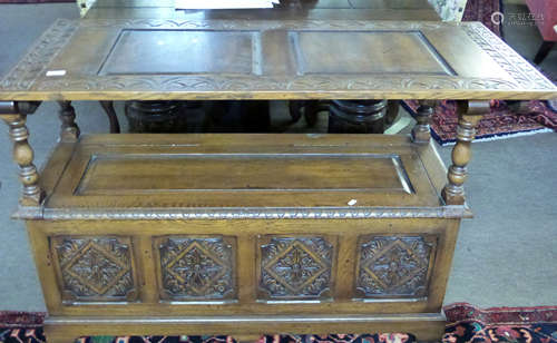 20th century monks oak bench having three bevelled panels to...