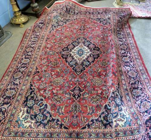 Red ground Persian Kashan carpet, with floral mediallion des...