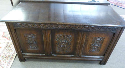 20th century carved oak coffer, two figure of eight and cent...