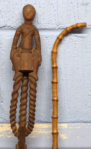 Unusual wooden walking stick, possibly African, modelled wit...