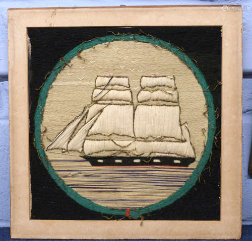 Embroidered picture of a ship in wooden frame