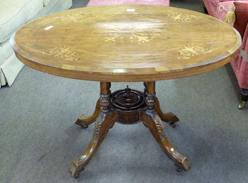 Victorian small walnut oval loo table, the top quartered ven...