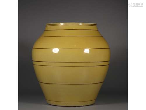 A YELLOW-GLAZE JAR