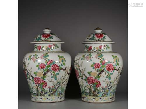 A PAIR OF FAMILLE ROSE JARS AND COVERS