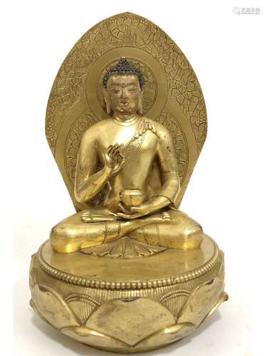 A GILT-BRONZE FIGURE OF SHKYAMUNI