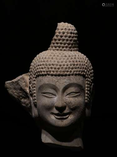 A STONE HEAD OF BUDDHA