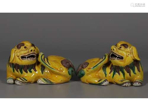 A PAIR OF YELLOW-GLAZE FIGURES OF LION