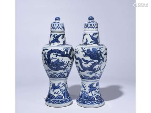 A PAIR OF BLUE AND WHITE VASES AND COVERS