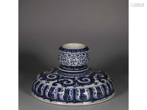 A BLUE AND WHITE CANDLE HOLDER