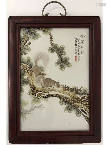 A PLAQUE OF TWO SQUIRRELS, FRAMED