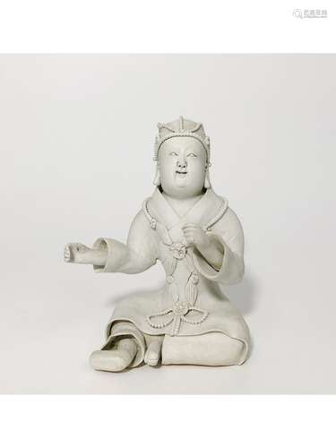 A WHITE-GLAZED FIGURE OF CHILD