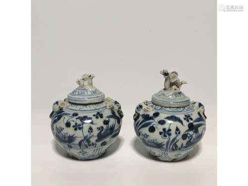 A PAIR OF BLUE AND WHITE JARS AND COVERS