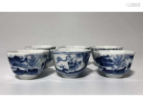 A SET OF BLUE AND WHITE CUPS