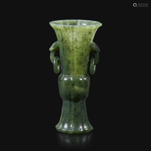 A small Chinese carved spinach green jade lobed gu-form