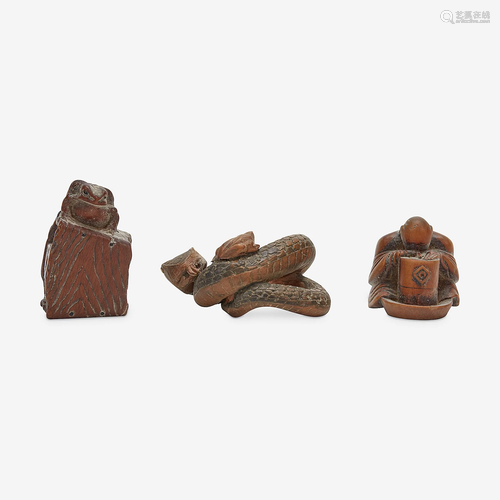 Three Japanese carved wood netsuke: measure and toad,