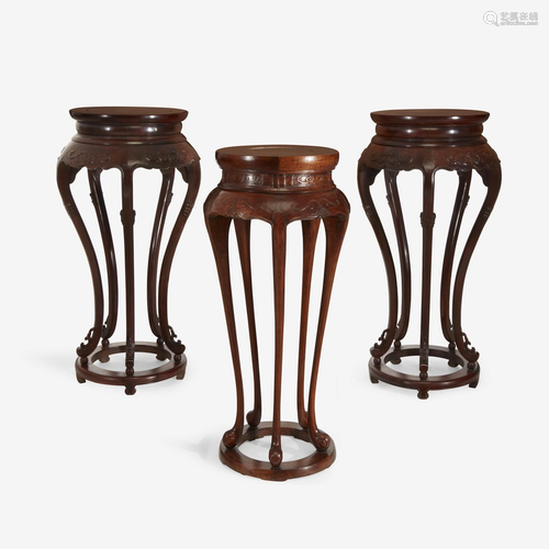 A pair of Chinese hardwood circular stands, together