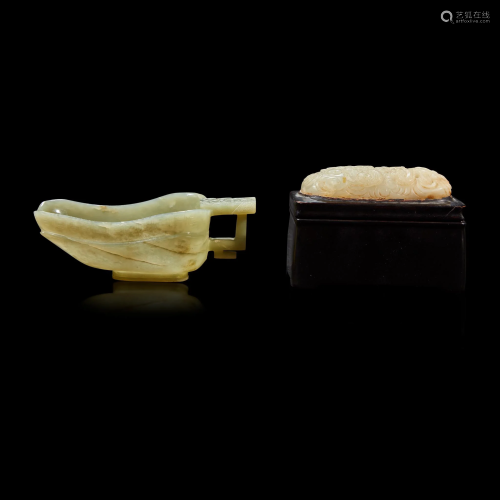 A Chinese celadon jade libation cup, Yi, and a carved