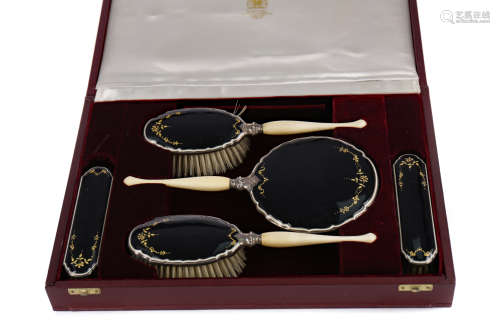 A CASED GEORGE V SILVER AND ENAMEL DRESSING TABLE SET