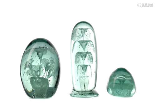 A LATE VICTORIAN GREEN GLASS DUMP PAPERWEIGHT AND TWO OTHERS