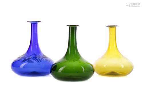 A COMPOSITE SET OF THREE COLOURED GLASS SHIPS DECANTERS