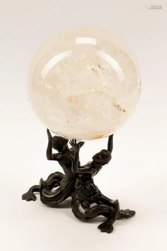 A Rock Crystal Spherical Ornament on a Patinated Bronze