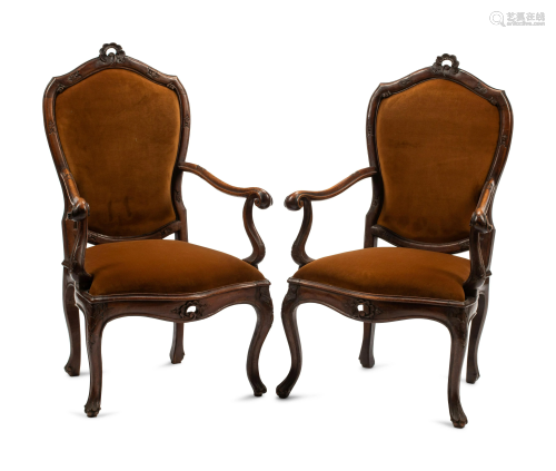 A Pair of Venetian Carved Walnut Armchairs