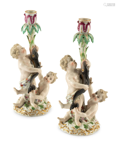 A Pair of Meissen Porcelain Figural Candlesticks