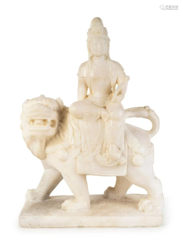 A Chinese Marble Figure of Guanyin Seated on a Fu Lion