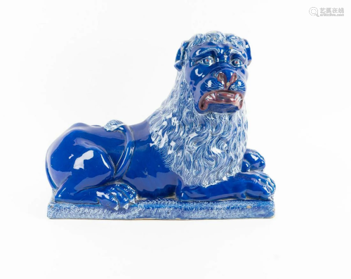 A Luneville Style Blue-Glazed Pottery Recumbent Lion