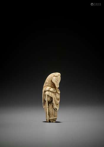 A GOOD IVORY NETSUKE OF A FOX PRIEST (HAKUZOSU)