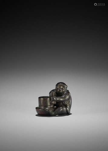 OKATOMO: A RARE SHITAN WOOD NETSUKE OF A MONKEY