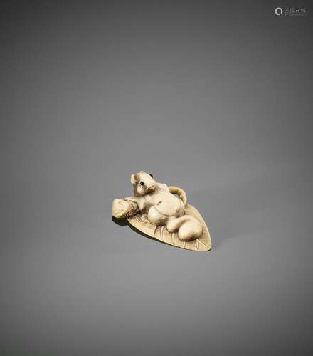 A CHARMING OSAKA SCHOOL IVORY NETSUKE OF A SQUIRREL ON A LEA...