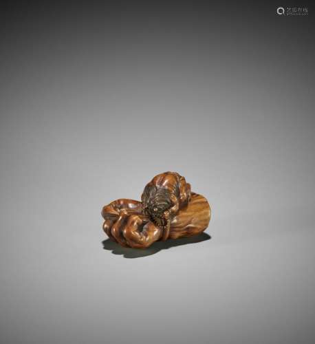 MASANAO: A WOOD NETSUKE OF A LAMENTING ONI WITH RASHOMON ARM