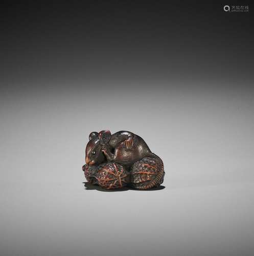 A YAMADA SCHOOL WOOD NETSUKE OF A RAT ON PEANUTS