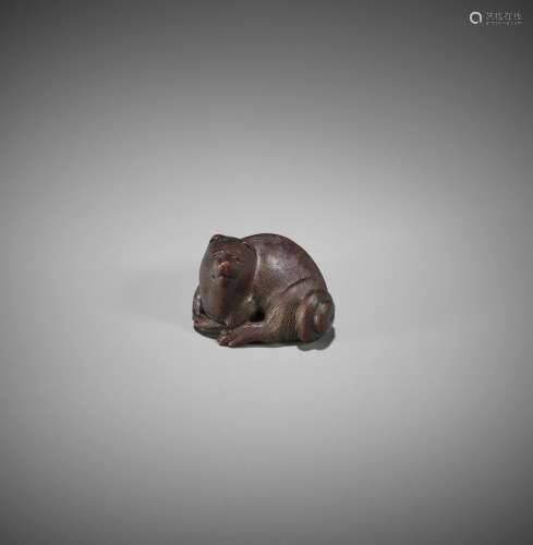 MASAMI: A FINE YAMADA SCHOOL WOOD NETSUKE OF A RECUMBENT TAN...