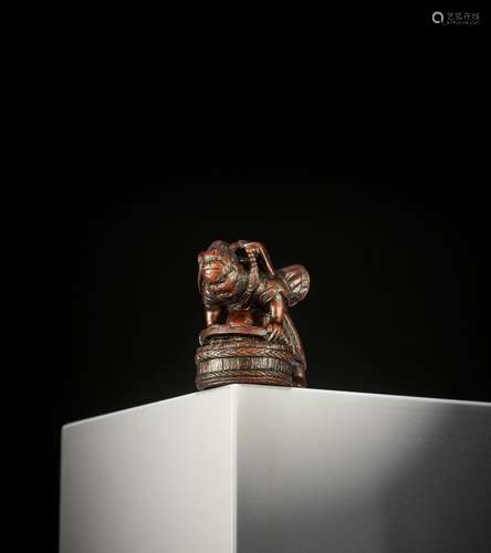 ITTAN: A WOOD NETSUKE OF SHOKI CAPTURING ONI