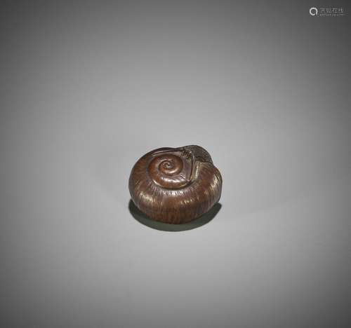 A NAGOYA SCHOOL WOOD NETSUKE OF A SNAIL