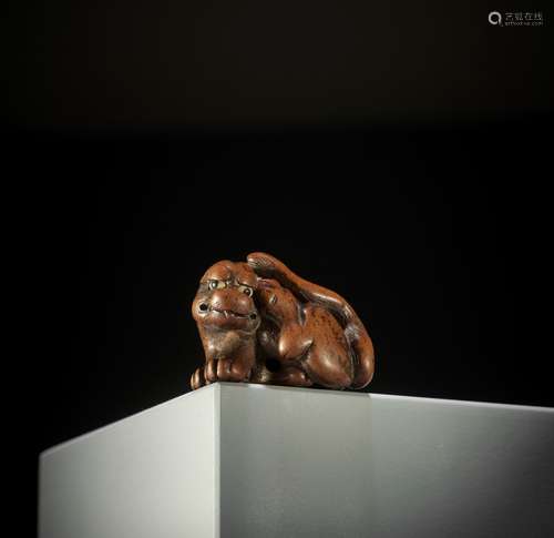 SATO MASAYOSHI: A FINE WOOD NETSUKE OF A TIGER