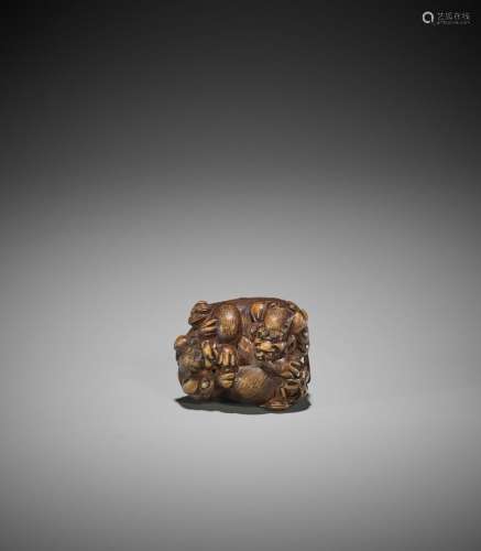 SATO MASAYOSHI: A WOOD NETSUKE OF TWO SHISHI WITH BROCADE BA...