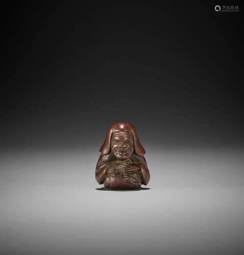 A WOOD SHUNGA NETSUKE OF A PRIEST