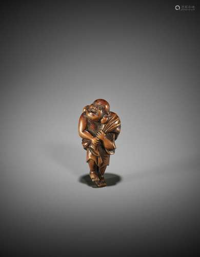 A GOOD WOOD NETSUKE OF HOTEI