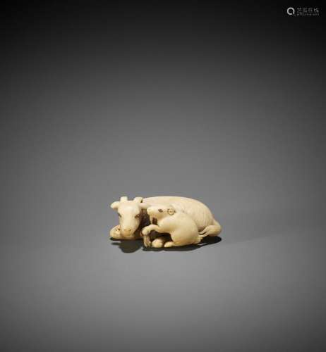 TOMOKAZU: AN IVORY NETSUKE OF A GOAT WITH YOUNG