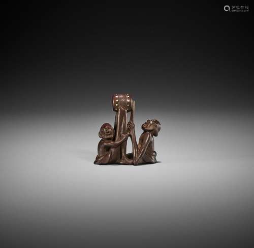 RAKUMIN: AN AMUSING WOOD NETSUKE OF ASHINAGA AND TENAGA PLAY...