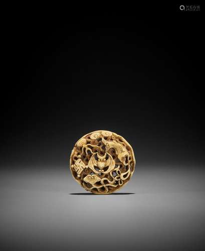 A WALRUS TOOTH RYUSA MANJU NETSUKE WITH AUSPICIOUS SYMBOLS