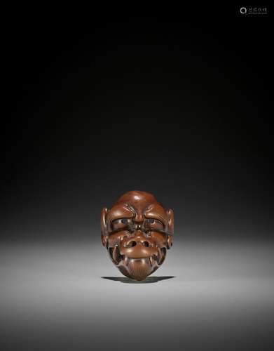 DEME UMAN: A SUPERB AND LARGE WOOD MASK NETSUKE OF A HORNLES...