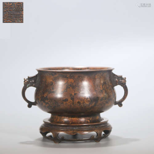 A DOUBLE-EARED BRONZE INCENSE BURNER