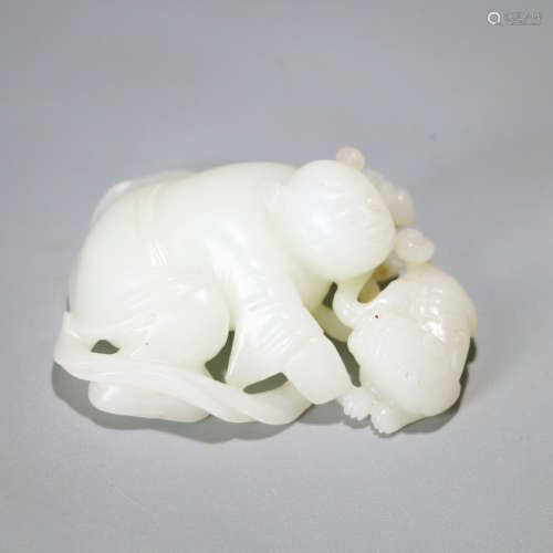 A HETIAN JADE CARVED BOY ORNAMENT