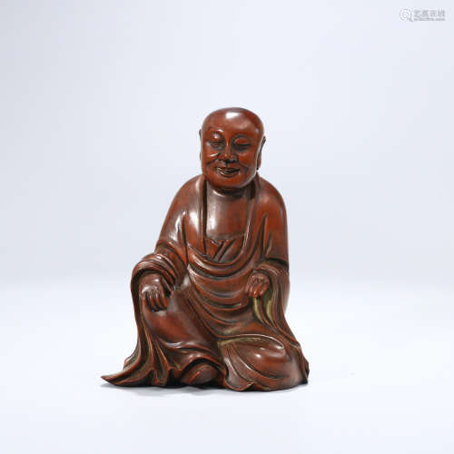 A BOXWOOD CARVED ARHAT STATUE ORNAMENT