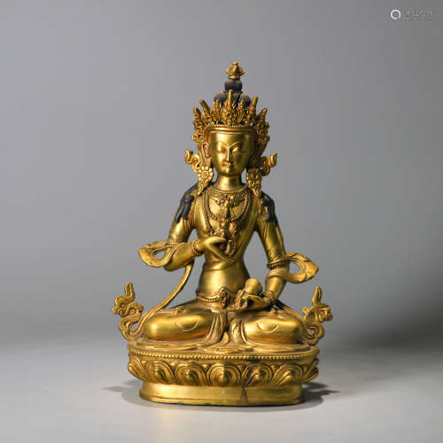 A GILT-BRONZE SEATED GUANYIN STATUE