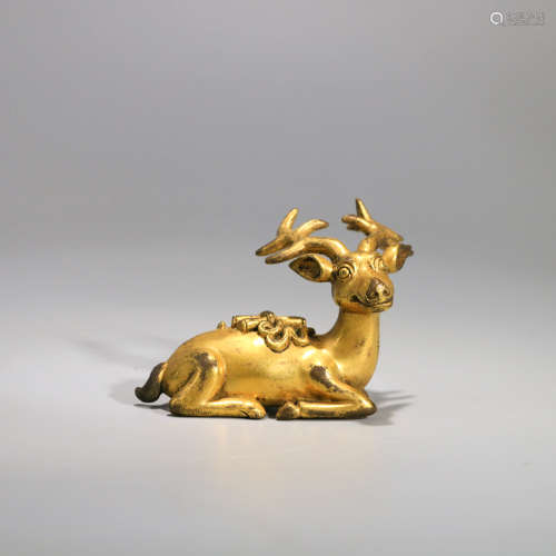 A GILT-BRONZE DEER ORNAMENT